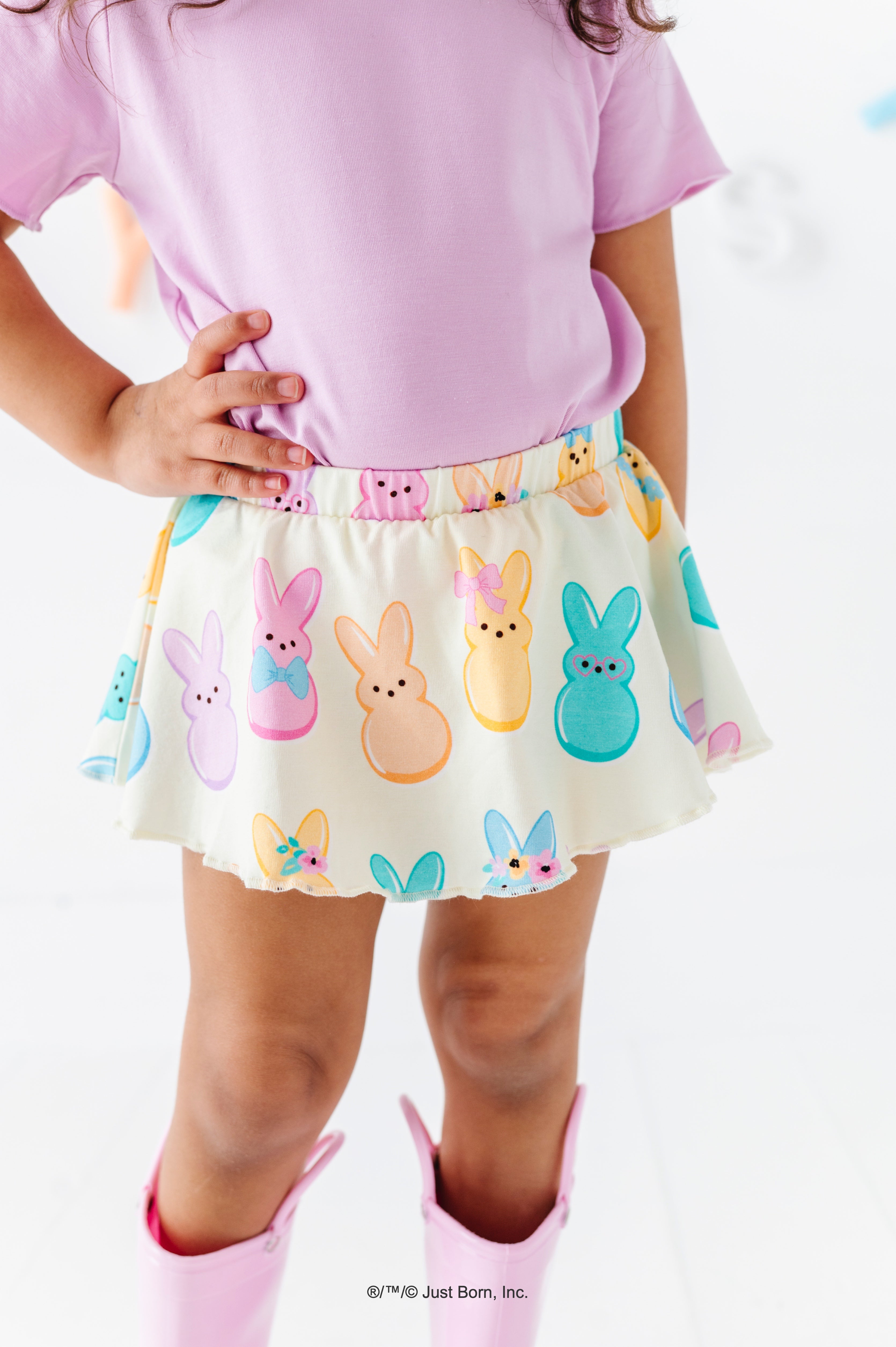 Child wearing a skirt with PEEPS® character design on a white background